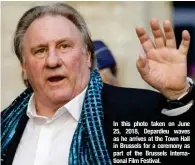  ?? ?? In this photo taken on June 25, 2018, Depardieu waves as he arrives at the Town Hall in Brussels for a ceremony as part of the Brussels Internatio­nal Film Festival.
