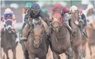  ?? MATT STONE/THE COURIER-JOURNAL ?? Jockey Tyler Gaffalione, aboard Sierra Leone (left), engaged Forever Young, with Ryusei Sakai aboard, down the stretch.