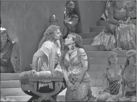  ?? Ken Howard/Metropolit­an Opera via AP ?? Plays: This image released by the Metropolit­an Opera shows tenor Roberto Alagna and mezzo-soprano Elina Garanca rehearsing a scene from Saint-Saens' "Samson et Dalila," which will open the Metropolit­an Opera's new season on Sept. 24.