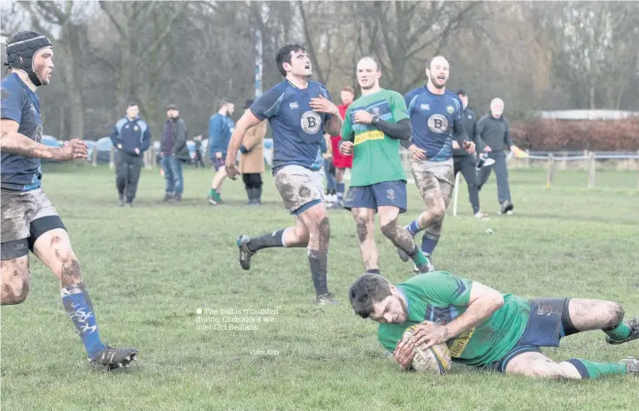  ?? The ball is grounded during Ormskirk’s win over Old Bedians Vince Ellis ??