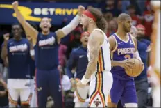  ?? AP photo ?? The Pelicans’ Jose Alvarado celebrates a charge called against the Suns’ Chris Paul in the second half of New Orleans’ Game 4 win over Phoenix on Sunday.