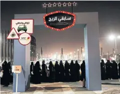  ?? AP ?? Women wait in line to ride go-carts at a road safety event for female drivers launched at the Riyadh Park Mall in Riyadh, Saudi Arabia.