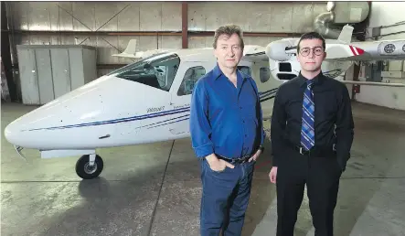  ?? JIM WELLS ?? Leon Cygman, chair of the Mount Royal Aviation Program and student Luc Sinal pose at the MRU Aviation campus at Springbank Airport on Thursday. Students with MRU’s aviation program learned that the school’s two remaining Tecnam twin-engine airplanes...