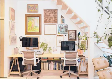  ?? KURT ARNOLD PHOTOS ?? To create a home office with two workstatio­ns, Kurt Arnold and Aya Maceda added a desk with Finnvard trestles from Ikea ($50) and Setu chairs from Herman Miller ($695 each) under the staircase.