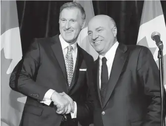  ?? NATHAN DENETTE, THE CANADIAN PRESS ?? Conservati­ve Party leadership candidate Maxime Bernier, left, appears with Kevin O’Leary at a news conference in Toronto on Wednesday.