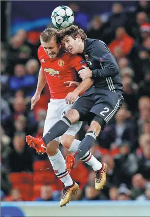  ?? PHIL NOBLE / REUTERS ?? Manchester United’s Luke Shaw (left) contests a header with CSKA Moscow’s Mario Fernandes during United’s 2-1 Champions League win at Old Trafford on Tuesday.