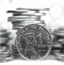  ?? PHOTO ?? The peso lost 0.06 centavos to close the session at P52.33:$1 from 52.27 Thursday.FILE