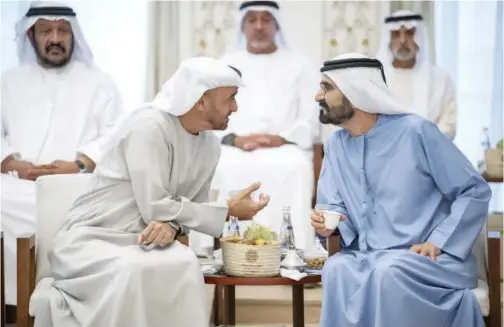  ?? WAM ?? ± Sheikh Mohamed Bin Zayed speaks with Sheikh Mohammed Bin Rashid at Sea Palace on Tuesday in Abu Dhabi.