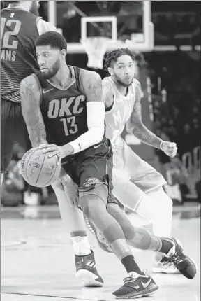  ?? Robert Gauthier Los Angeles Times ?? PAUL GEORGE (13) and the Thunder had it rolling against Brandon Ingram and the Lakers at Staples Center, handing the home team its worst loss of the season.