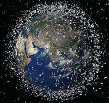  ?? Fotos: Esa, dpa ?? Der Schrott kann Satelliten gefährlich werden. Dieses computerge­nerierte Bild der European Space Agency (Esa) zeigt den Müll früherer Weltraummi­ssionen, der neben intakten Satelliten um die Erde kreist.