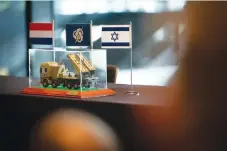  ?? (Elbit Systems) ?? A MODEL OF a PULS artillery rocket system with flags of Israel and the Netherland­s.