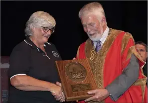  ??  ?? Director Breda Hayes accepted a plaque on behalf of the Ballycogle­y Players.