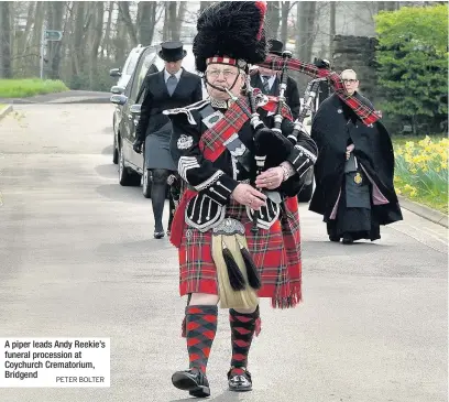  ??  ?? A piper leads Andy Reekie’s funeral procession at Coychurch Crematoriu­m, Bridgend