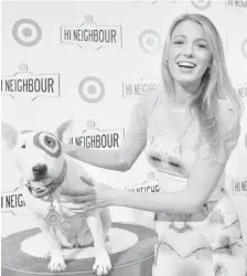  ?? GEORGE PIMENTEL/GETTY Images ?? Actress Blake Lively attends the opening of Target, alongside the mascot, Bullseye, at Shoppers World Danforth on Wednesday in Toronto.