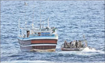  ??  ?? Photo shows a HMAS Warramunga boarding team preparing to board a vessel of interest at sea, later finding narcotics onboard.