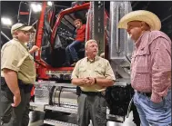  ?? (Arkansas Democrat-Gazette/Staci Vandagriff) ?? Agent Justin Smith (left) and Assistant Chief Russ Lancaster (center), both with the State Department of Agricultur­e’s law enforcemen­t team, talk with Keith Stokes, an agricultur­e project manager for the office of U.S. Sen. Tom Cotton, R-Ark., while he attends the Southwest Forest Expo with his grandson Colt Stokes, 7, on Friday at the Hot Springs Convention Center.