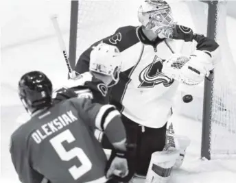  ??  ?? Stars defenseman Jamie Oleksiak puts the puck past Avalanche goaltender Calvin Pickard during the second period of Colorado’s 4-2 loss in Dallas. LM Otero, The Associated Press