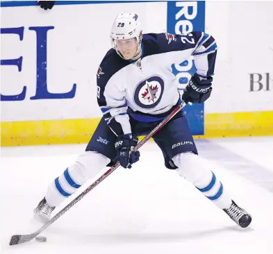  ?? BILLY HURST / THE ASSOCIATED PRESS ?? At 18 years old, Jets winger Patrik Laine is tied for the NHL lead in goals (16) entering Monday night’s games.