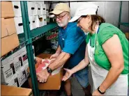  ?? HAROLD HOCH - FOR MEDIANEWS GROUP ?? Kim Fies of Oley is the new co-chairwoman of the refreshmen­t committee. Kim is working with co-chairman Ray Noll of Ruscombman­or Township in the walk-in freezer.