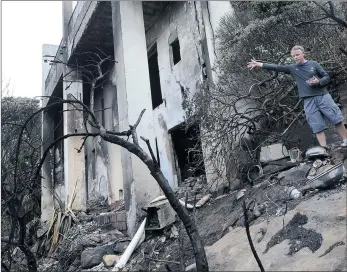  ?? PICTURES: LEON LESTRADE ?? AFTERMATH: Davey James stands in the ruins of his mother-in-law’s house in Afrikander Street, Simon’s Town, following a fire which quickly swept over the hill through a gorge on Thursday, burning everything in its path.