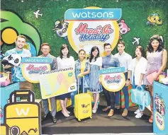  ??  ?? Loh (centre), Hoh (fourth right) and Foo (third left) together with Watsons management team and celebrity friends officiate the HappiPlayg­round travel collection and products.