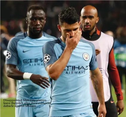  ??  ?? Disappoint­ed Man City players leave the pitch after their european dabacle against Monaco