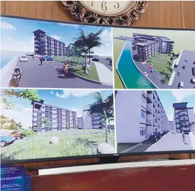  ?? / MANDAUE CITY PUBLIC INFORMATIO­N OFFICE ?? PROPOSAL. Officials of Mandaue’s City Planning and Developmen­t Office and the Housing and Urban Developmen­t Office presented to Mayor Jonas Cortes their designs for the proposed five-story mid-rise socialized housing project that they plan to build in Brgy. Tipolo. More than 500 families who lost their homes in a fire that hit Tipolo in 2019 will benefit from the project.