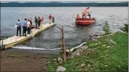  ?? PHOTO PROVIDED BY SAUGERTIES POLICE ?? Kayaker Tyler Brinkhuis is brought to shore by rescue workers on Saturday, Aug. 12, 2017, in Glasco, N.Y.