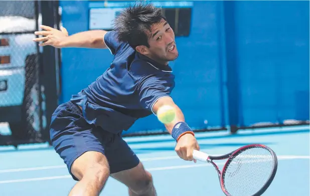  ?? Picture: STEWART McLEAN ?? TESTING GROUND: Japan’s Masayoshi Ono reaches for a ball, the new Dunlop variety, during the Cairns Tennis Internatio­nal.