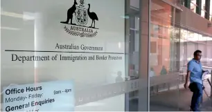  ?? AP ?? A man leaves the Department of Immigratio­n and Border Protection offices in Sydney. —