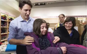 ?? NATHAN DENETTE/THE CANADIAN PRESS ?? Prime Minister Justin Trudeau’s photo-op with Syrian refugees symbolizes Canada’s will to help people in need. But we must realize that we have yet to be tested like some European countries, writes Martin Regg Cohn.