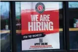  ?? AP PHOTO/NAM Y. HUH ?? A hiring sign is displayed Monday at a restaurant in Rolling Meadows, Ill. January’s job growth has been surprising­ly robust in the face of steep interest rate increases.