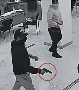  ?? ?? A camera filmed the robbers entering one of the banks