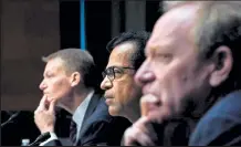  ?? Drew Angerer / Getty Images ?? Left to right, Fireeye CEO Kevin Mandia, Solarwinds CEO Sudhakar Ramakrishn­a and Microsoft President Brad Smith testify Feb. 23 during a Senate Intelligen­ce Committee hearing on Capitol Hill in Washington.