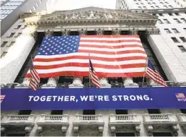  ?? MARK LENNIHAN AP ?? Flags decorate the New York Stock Exchange on Thursday. Financial industry leaders are pledging to hire more Black executives in light of recent events.