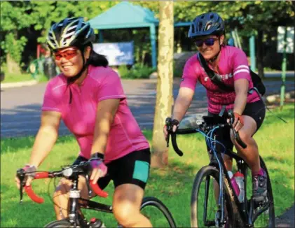  ??  ?? Female riders wear smiles as they participat­e in a weekly group ride from Riverfront Park in Pottstown.