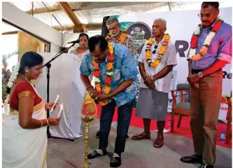  ?? ?? Minister for Employment, Productivi­ty and Industrial Relations, Youth and Sports, Parveen Kumar lights up the Diya at the 143rd Girmit Remembranc­e Day celebratio­n.