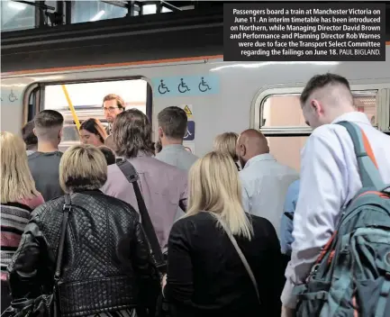  ?? PAUL BIGLAND. ?? Passengers board a train at Manchester Victoria on June 11. An interim timetable has been introduced on Northern, while Managing Director David Brown and Performanc­e and Planning Director Rob Warnes were due to face the Transport Select Committee regarding the failings on June 18.