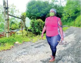  ?? ERROL CROSBY ?? Donna Emmanuel-Mitchell on her five-mile journey from Bethel Gap to her Albion Mountain in St Thomas on Wednesday.