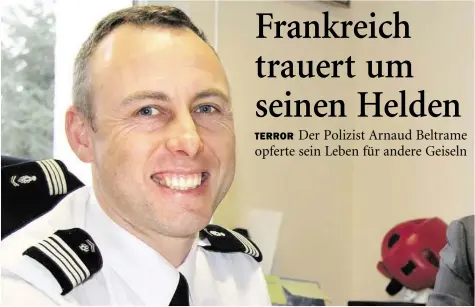  ?? BILD: AP ?? Ganz Frankreich trauert um den 45-jährigen Polizisten Arnaud Beltrame, der sich gegen Geiseln eintausche­n ließ.