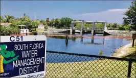  ?? HOWARD GOODMAN / THE PALM BEACH POST ?? South Florida Water Management District supervises some 2,000 miles of canals, but the system won’t perform as designed when seas get higher.