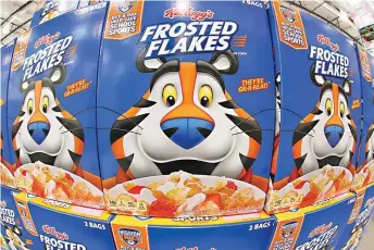  ?? AP Photo/Gene J. Puskar, File ?? This is a display of Kellogg’s Frosted Flakes cereal on May 14, 2020, at a Costco Warehouse in Homestead, Pa. Kellogg’s announced Tuesday that it is splitting into three companies: a cereal maker, a snack maker anda plantbased food company. Kellogg’s, whose brands include Eggo waffles, Rice Krispies cereal and MorningSta­rFarms vegetarian products, said the proposed spinoffs of the yet to be named cereal and plant-based companiesa­re expected to be completed by the end of 2023.