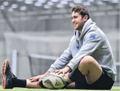  ?? PHOTO: PETER MCINTOSH ?? Relax . . . Otago lock Tom Rowe has a rest during an Otago training at the Edgar Centre on Monday.