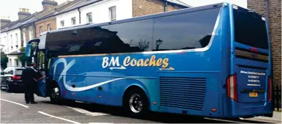  ??  ?? Unauthoris­ed: The coach that took Chinese tourists to a road near Grenfell Tower for photos