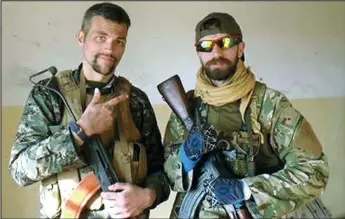  ??  ?? War veterans: Jamie Read, right, in Syria with American comrade Jordan Matson