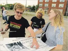  ?? CLIFFORD SKARSTEDT/EXAMINER FILE PHOTO ?? Marion Burton (left), president of the Peterborou­gh and District Labour Council, takes part in an Injured Workers' Day event outsidethe General Electric plant on May 31. Burton announced Tuesday that she won’t run for re-election as council president.