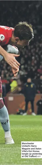  ?? AFP ?? Manchester United’s Harry Maguire and Aston Villa’s Ezri Konsa tangle up yesterday at Old Trafford