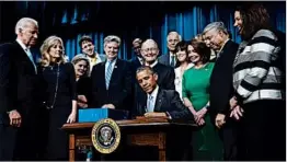  ?? PABLO MARTINEZ MONSIVAIS/AP ?? President Obama signs the 21st Century Cures Act, which had bipartisan support.