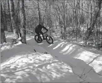  ?? CONTRIBUTE­D PHOTO ?? A cyclist rides a fat bike on the trails at Mark Arendz Provincial Ski Park.