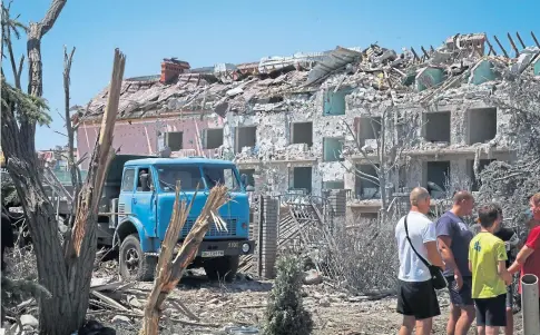  ?? ?? TERROR: A block of flats devastated by a Russian missile attack in the town of Serhiivka near the port of Odesa.